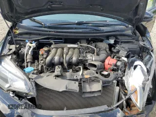 2015 Honda Fit EX-L z VIN 3HGGK5H88FM705989, wystawiony jako Copart lot #57143835 z przebiegiem 132 747 mil mil oraz Szkoda całkowita • Salvage title. Historia ofert i sprzedaży dostępna na DreamBid. Obrazek 11.