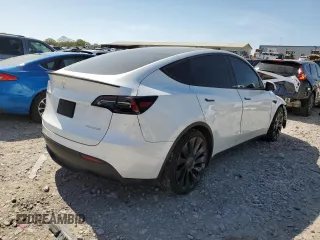 2021 Tesla Model Y Performance with VIN 5YJYGDEF7MF269221, listed as a Copart auction lot 52109785 with 61,619 mi miles and Salvage Title. Bid and sale history available at DreamBid. Image 3.