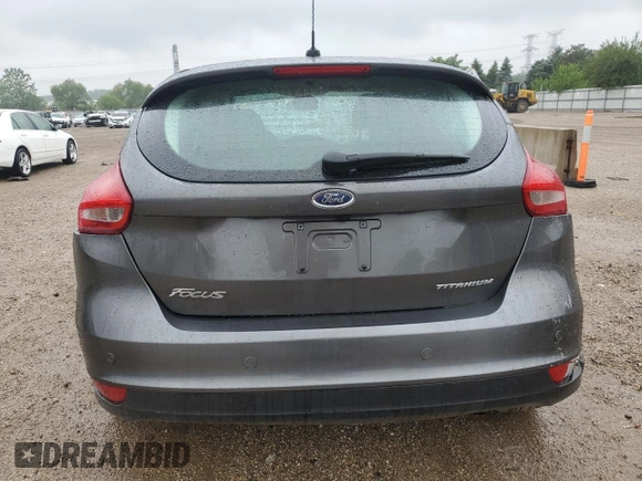 2018 Ford Focus Titanium z VIN 1FADP3N21JL295883, wystawiony jako Copart lot #59051015 z przebiegiem 43 284 mil mil oraz Szkoda całkowita • Salvage title. Historia ofert i sprzedaży dostępna na DreamBid. Obrazek 6.