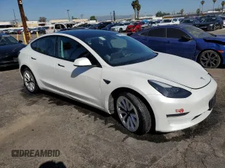 2023 Tesla Model 3 with VIN 5YJ3E1EA7PF450343, listed as a Copart auction lot 52446595 with 36,137 mi miles and Salvage Title. Bid and sale history available at DreamBid. Image 4.