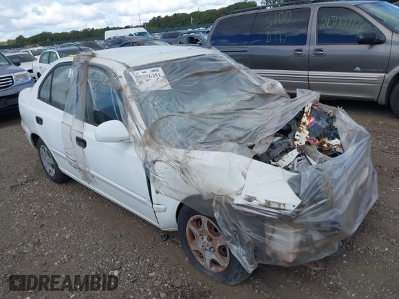 2004 Hyundai Accent GL z VIN KMHCG45C24U559935, wystawiony jako IAAI lot #40487927 z przebiegiem Nie podano mil oraz . Historia ofert i sprzedaży dostępna na DreamBid. Obrazek 1.