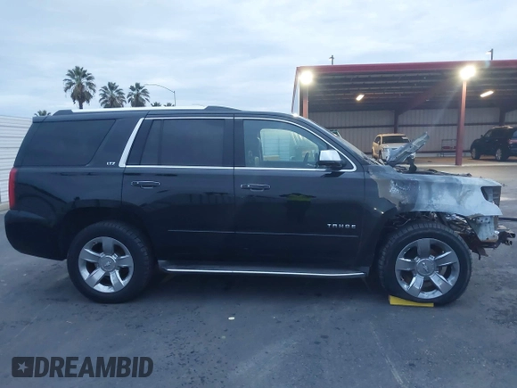 2015 Chevrolet Tahoe LTZ z VIN 1GNSKCKC5FR213209, wystawiony jako IAAI lot #41023368 z przebiegiem Nie podano mil oraz . Historia ofert i sprzedaży dostępna na DreamBid. Obrazek 12.