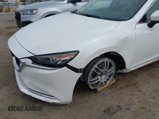 2018 Mazda 6 Grand Touring Reserve with VIN JM1GL1WYXJ1300116, listed as a IAAI auction lot 42088015 with 57,760 mi miles and . Bid and sale history available at DreamBid. Image 6.