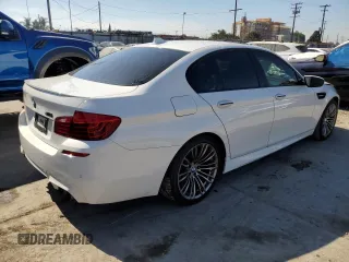 2014 BMW M5 with VIN WBSFV9C57ED097570, listed as a Copart auction lot 88571785 with 100,391 mi miles and Salvage Title. Bid and sale history available at carsss.com. Image 3.
