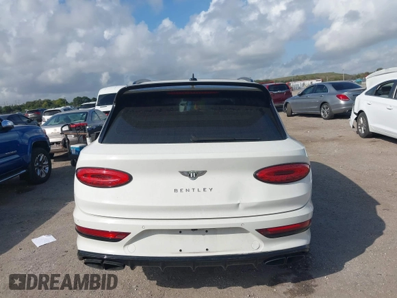 2022 Bentley Bentayga V8 z VIN SJAAM2ZV2NC013035, wystawiony jako IAAI lot #41487773 z przebiegiem 35 500 mil mil oraz . Historia ofert i sprzedaży dostępna na DreamBid. Obrazek 16.