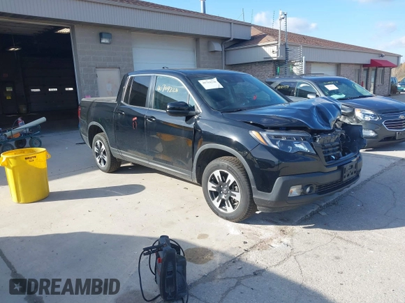 2020 Honda Ridgeline RTL with VIN 5FPYK3F59LB023212, listed as a IAAI auction lot 40704228 with 73,259 mi miles and . Bid and sale history available at DreamBid. Image 1.