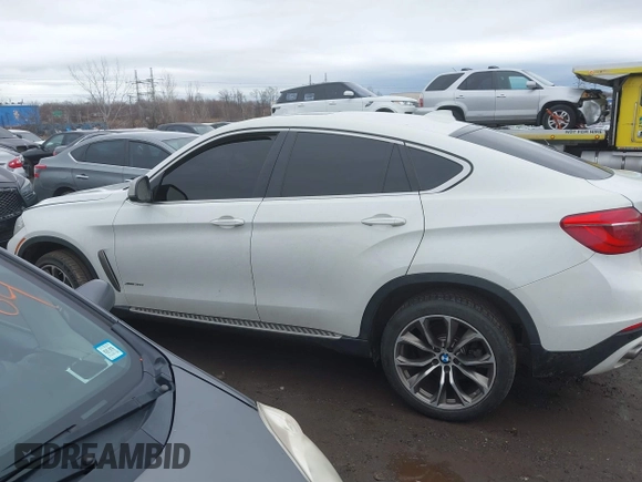2015 BMW X6 xDrive35i with VIN 5UXKU2C57F0N77194, listed as a IAAI auction lot 41818860 with 105,579 mi miles and . Bid and sale history available at DreamBid. Image 14.