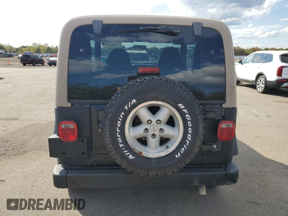 1999 Jeep Wrangler Sport z VIN 1J4FY19SXXP465037, wystawiony jako Copart lot #54772405 z przebiegiem 50 942 mil mil oraz Nie do naprawy • Non repairable. Historia ofert i sprzedaży dostępna na DreamBid. Obrazek 6.