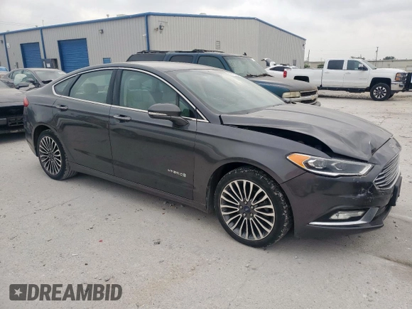 2017 Ford Fusion Hybrid Titanium with VIN 3FA6P0RU7HR388521, listed as a Copart auction lot 57318895 with 117,720 mi miles and Salvage title. Bid and sale history available at DreamBid. Image 4.