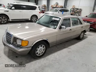 1990 Mercedes-Benz 560 with VIN WDBCA39E7LA517710, listed as a Copart auction lot 85307074 with 225,233 mi miles and Salvage Title. Bid and sale history available at DreamBid. Image 1.