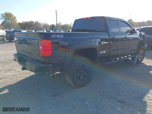 2017 Chevrolet Silverado 1500 LT with VIN 1GCVKREC0HZ293560, listed as a IAAI auction lot 40706331 with 133,438 mi miles. Bid and sale history available at carsss.com. Image 4.