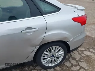 2017 Ford Focus Titanium with VIN 1FADP3J24HL229702, listed as a IAAI auction lot 42057013 with 120,250 mi miles and . Bid and sale history available at DreamBid. Image 6.