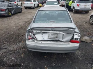 2002 Mazda Protege DX with VIN JM1BJ225920515625, listed as a IAAI auction lot 41144290 with 230,434 mi miles. Bid and sale history available at carsss.com. Image 16.