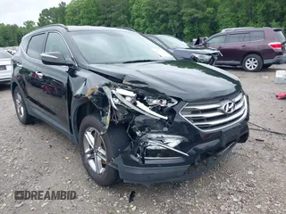2017 Hyundai Santa Fe 2.4L z VIN 5NMZUDLB1HH034699, wystawiony jako IAAI lot #42337740 z przebiegiem 157 836 mil mil oraz . Historia ofert i sprzedaży dostępna na DreamBid. Obrazek 1.