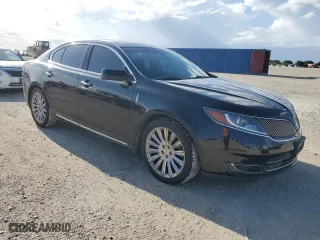 2014 Lincoln MKS with VIN 1LNHL9EK6EG604428, listed as a Copart auction lot 59758884 with 122,833 mi miles and Salvage Title. Bid and sale history available at carsss.com. Image 4.