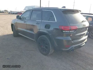 2015 Jeep Grand Cherokee SRT with VIN 1C4RJFDJ9FC842448, listed as a IAAI auction lot 41850385 with 178,439 mi miles. Bid and sale history available at carsss.com. Image 3.