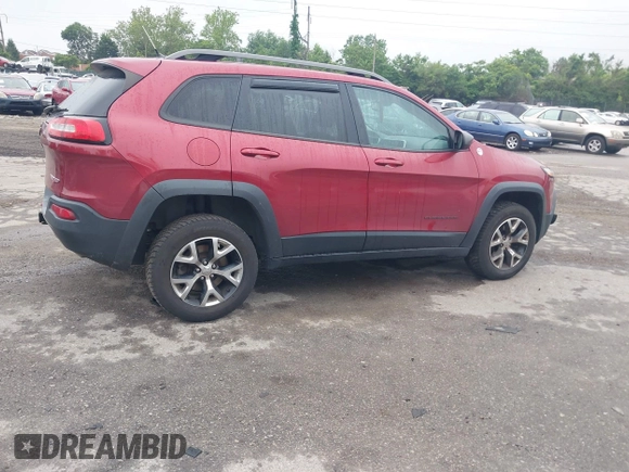 2015 Jeep Cherokee Trailhawk with VIN 1C4PJMBSXFW667469, listed as a IAAI auction lot 42438006 with 127,136 mi miles and . Bid and sale history available at DreamBid. Image 4.