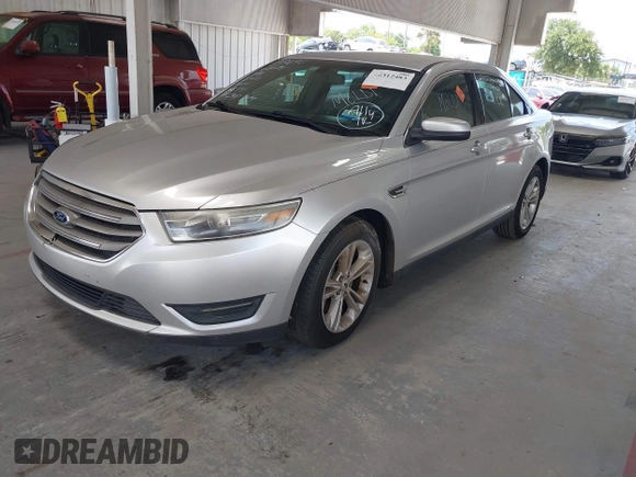 2014 Ford Taurus SEL z VIN 1FAHP2E82EG139690, wystawiony jako IAAI lot #42312483 z przebiegiem 170 029 mil mil oraz . Historia ofert i sprzedaży dostępna na DreamBid. Obrazek 2.