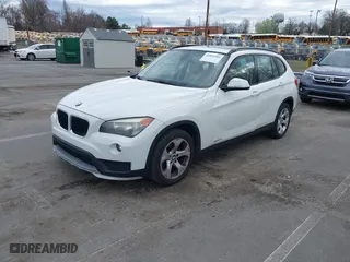 2015 BMW X1 sDrive28i with VIN WBAVM1C50FV314957, listed as a IAAI auction lot 41816402 with 148,410 mi miles. Bid and sale history available at carsss.com. Image 2.