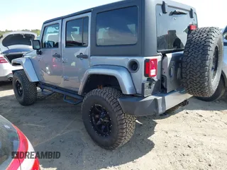 2015 Jeep Wrangler Unlimited Sahara with VIN 1C4BJWEG2FL558860, listed as a IAAI auction lot 41937360 with 113,627 mi miles. Bid and sale history available at carsss.com. Image 3.