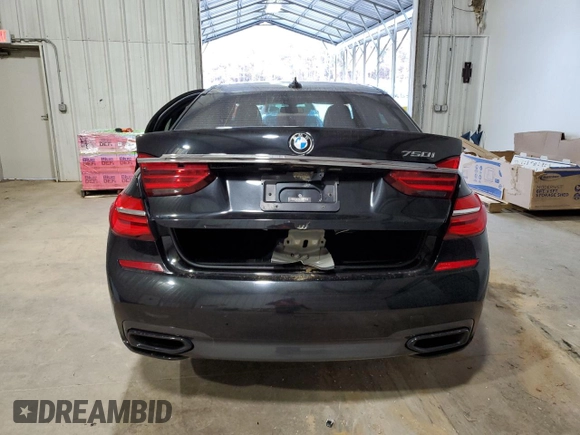 2016 BMW 7 Series 750i with VIN WBA7F0C5XGGL99017, listed as a Copart auction lot 84934504 with 0 mi miles and Salvage Title. Bid and sale history available at carsss.com. Image 6.