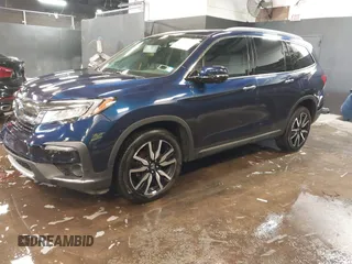 2022 Honda Pilot Touring 7-Passenger with VIN 5FNYF6H65NB052164, listed as a IAAI auction lot 41641601 with 51,700 mi miles. Bid and sale history available at carsss.com. Image 20.