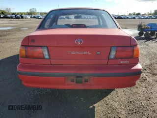 1994 Toyota Tercel DX z VIN JT2EL43E8R0472965, wystawiony jako Copart lot #75007574 z przebiegiem 212 133 mil mil oraz Czysty tytuł • Clean title. Historia ofert i sprzedaży dostępna na DreamBid. Obrazek 6.