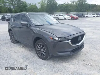 2018 Mazda CX-5 Touring z VIN JM3KFACM1J1407050, wystawiony jako IAAI lot #42430879 z przebiegiem 68 362 mil mil oraz . Historia ofert i sprzedaży dostępna na DreamBid. Obrazek 1.