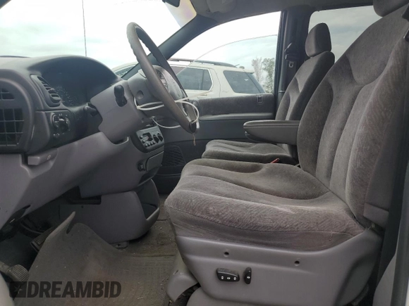1999 Plymouth Voyager Grand SE z VIN 1P4GP44G7XB831207, wystawiony jako Copart lot #79558714 z przebiegiem 163 620 mil mil oraz Szkody całkowita. Historia ofert i sprzedaży dostępna na DreamBid. Obrazek 7.