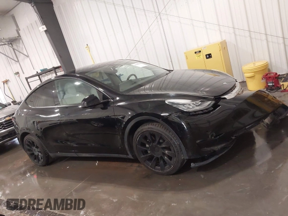 2021 Tesla Model Y Long Range with VIN 5YJYGAEE5MF305655, listed as a IAAI auction lot 41860993 with 50,750 mi miles. Bid and sale history available at carsss.com. Image 13.