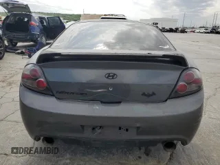 2007 Hyundai Tiburon GS z VIN KMHHM66D47U243846, wystawiony jako Copart lot #57509725 z przebiegiem 181 941 mil mil oraz Szkoda całkowita • Salvage title. Historia ofert i sprzedaży dostępna na DreamBid. Obrazek 6.