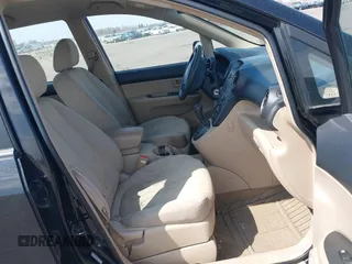 2007 Kia Rondo LX with VIN KNAFG525877029532, listed as a IAAI auction lot 42036604 with 225,698 mi miles. Bid and sale history available at carsss.com. Image 5.