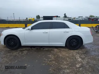 2014 Chrysler 300 with VIN 2C3CCAAG2EH235495, listed as a IAAI auction lot 41787801 with 142,354 mi miles and . Bid and sale history available at DreamBid. Image 14.
