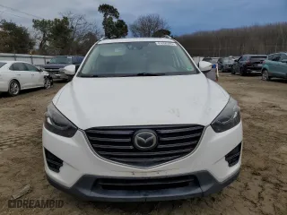 2016 Mazda CX-5 Grand Touring with VIN JM3KE2DY2G0860473, listed as a Copart auction lot 41800395 with 132,293 mi miles and Salvage Title. Bid and sale history available at carsss.com. Image 5.