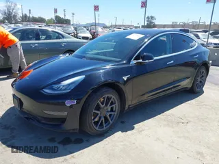 2019 Tesla Model 3 Mid Range with VIN 5YJ3E1EA3KF325056, listed as a IAAI auction lot 41771543 with 183,157 mi miles and . Bid and sale history available at carsss.com. Image 2.