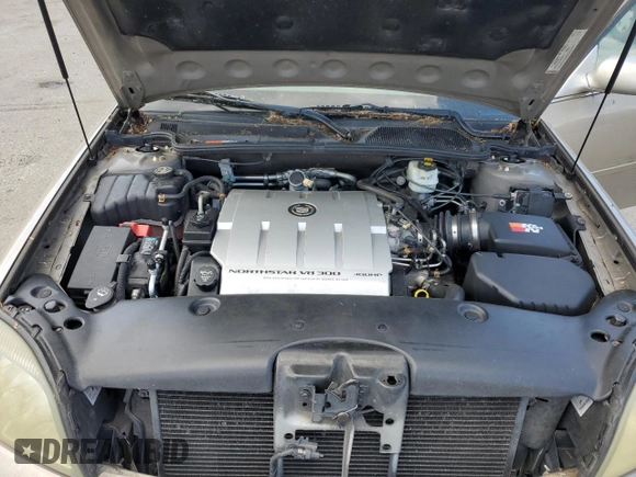 2004 Cadillac DeVille DTS z VIN 1G6KF579X4U212415, wystawiony jako Copart lot #58005555 z przebiegiem 97 663 mil mil oraz Tytuł czysty. Historia ofert i sprzedaży dostępna na DreamBid. Obrazek 11.