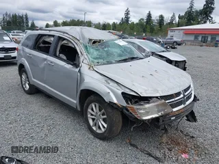 2013 Dodge Journey SXT with VIN 3C4PDDBG1DT507356, listed as a IAAI auction lot 42592501 with 128,094 mi miles and . Bid and sale history available at DreamBid. Image 1.