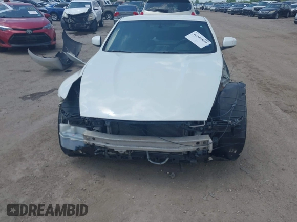 2012 Nissan 370Z z VIN JN1AZ4EH5CM564517, wystawiony jako IAAI lot #42385869 z przebiegiem 55 359 mil mil oraz . Historia ofert i sprzedaży dostępna na DreamBid. Obrazek 13.