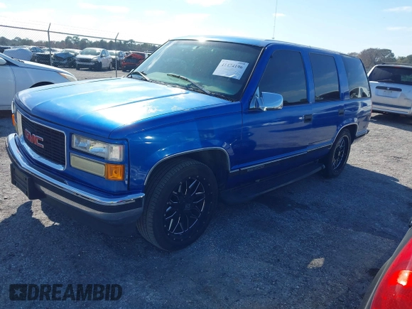 1997 GMC Yukon with VIN 1GKEC13R0VJ744958, listed as a IAAI auction lot 41474196 with 257,847 mi miles. Bid and sale history available at carsss.com. Image 2.