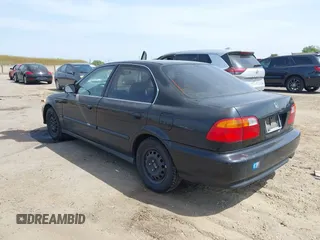 1999 Honda Civic LX with VIN JHMEJ6674XS003829, listed as a IAAI auction lot 42121298 with 238,936 mi miles. Bid and sale history available at carsss.com. Image 3.