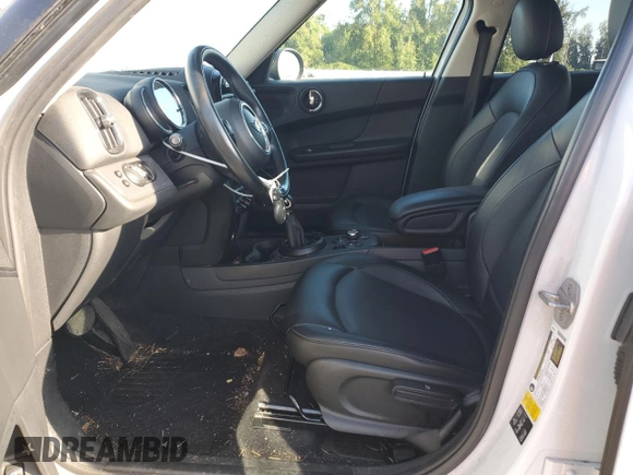 2019 MINI Countryman Cooper with VIN WMZYV5C51K3F57741, listed as a Copart auction lot 71293094 with 64,761 mi miles and Salvage Title. Bid and sale history available at carsss.com. Image 7.