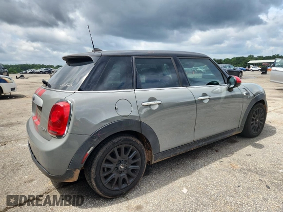 2015 MINI Hardtop 4 Door with VIN WMWXS5C5XFT831555, listed as a Copart auction lot 61673485 with 104,120 mi miles and Salvage title. Bid and sale history available at DreamBid. Image 3.