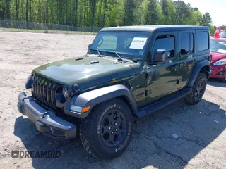 2023 Jeep Wrangler Sport S with VIN 1C4HJXDN0PW695795, listed as a IAAI auction lot 41974691 with 32,734 mi miles and . Bid and sale history available at DreamBid. Image 2.