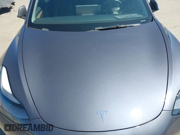 2023 Tesla Model 3 with VIN 5YJ3E1EAXPF405588, listed as a IAAI auction lot 42348952 with 30,788 mi miles and . Bid and sale history available at DreamBid. Image 10.