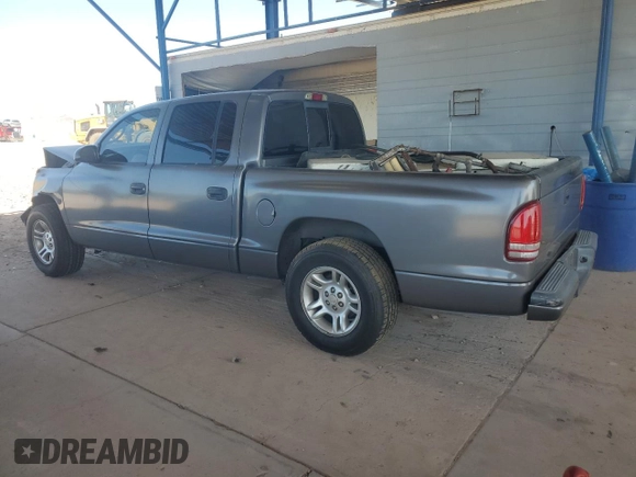 2001 Dodge Dakota Sport z VIN 1B7HL2AN21S298590, wystawiony jako Copart lot #54430385 z przebiegiem 175 365 mil mil oraz Szkoda całkowita • Salvage title. Historia ofert i sprzedaży dostępna na DreamBid. Obrazek 2.