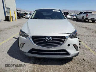 2018 Mazda CX-3 Touring z VIN JM1DKFC74J0312864, wystawiony jako Copart lot #55862845 z przebiegiem 75 584 mil mil oraz Szkoda całkowita • Salvage title. Historia ofert i sprzedaży dostępna na DreamBid. Obrazek 5.