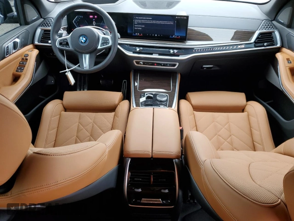2024 BMW X5 xDrive50e with VIN 5UX43EU02R9U91727, listed as a Copart auction lot 64155574 with 7,050 mi miles and Salvage Title. Bid and sale history available at carsss.com. Image 8.