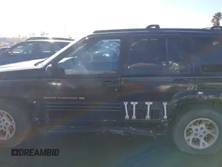 1998 Jeep Grand Cherokee Limited z VIN 1J4GZ78Y3WC105625, wystawiony jako IAAI lot #41742805 z przebiegiem 222 045 mil mil oraz . Historia ofert i sprzedaży dostępna na DreamBid. Obrazek 14.