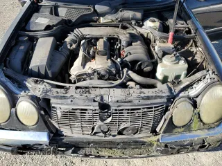1997 Mercedes-Benz E-Class with VIN WDBJF55F5VJ028552, listed as a Copart auction lot 84172054 with 308,426 mi miles and Clean Title. Bid and sale history available at carsss.com. Image 11.