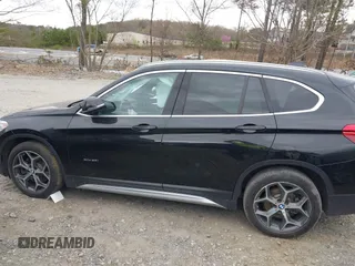 2018 BMW X1 xDrive28i with VIN WBXHT3C34J5K21576, listed as a IAAI auction lot 41822390 with 69,645 mi miles. Bid and sale history available at carsss.com. Image 14.